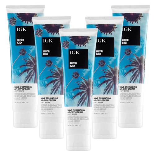 Six tubes of IGK Rich Kid hair cream with a palm tree design.
