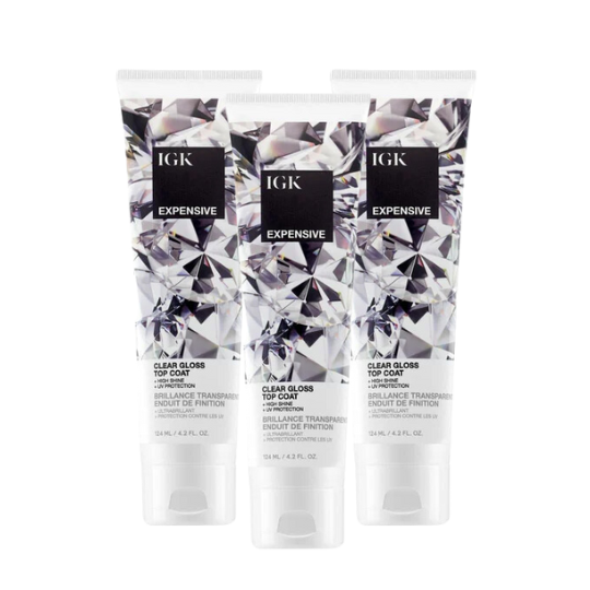 Three tubes of IGK Expensive Clear Gloss with a crystal design label.