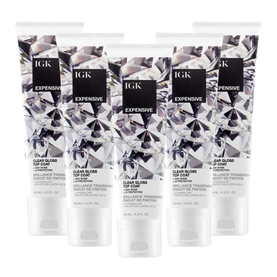 Five IGK Expensive Clear Gloss Top Coat tubes arranged in a group.