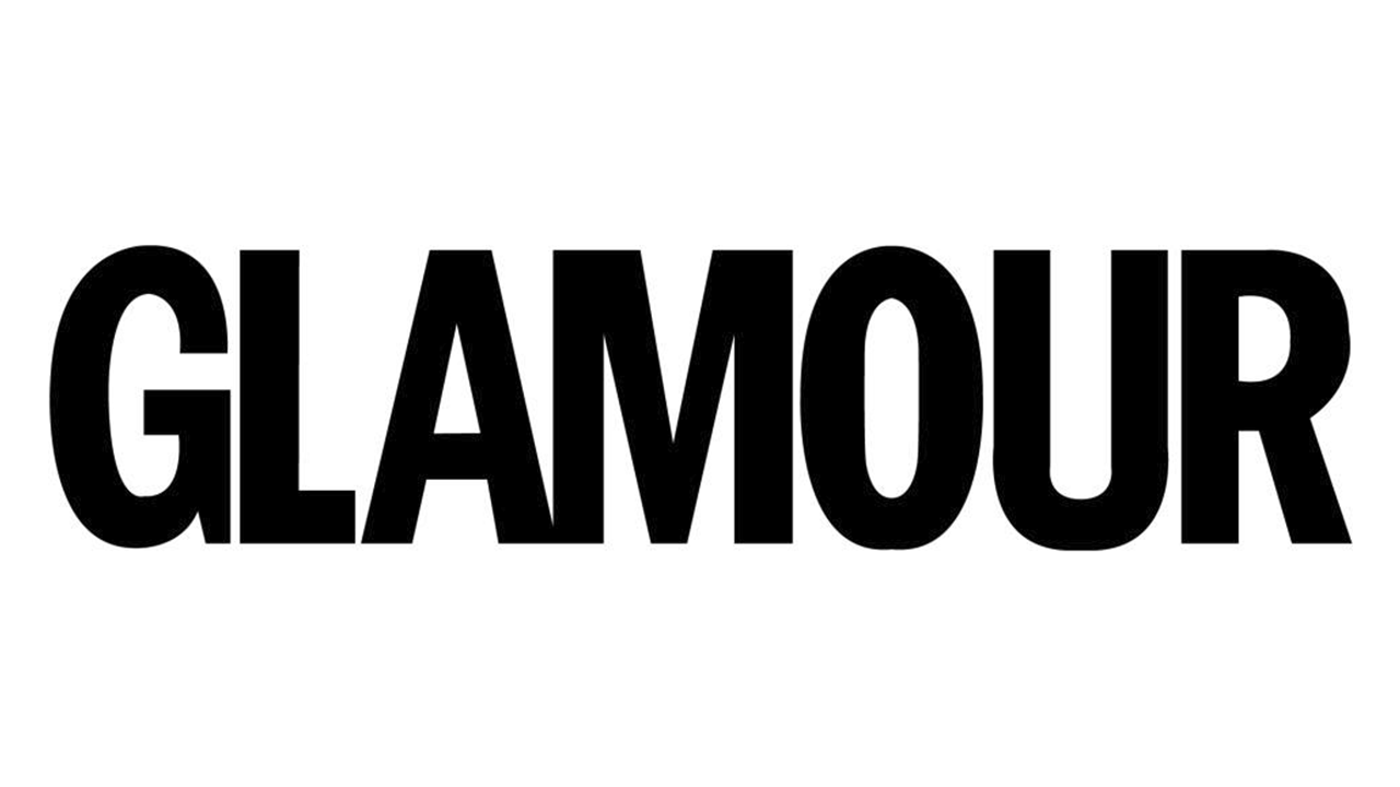 An island mansion surrounded by water, viewed from above.