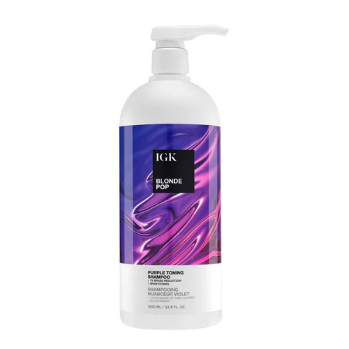 Bottle of IGK Blonde Pop Purple Toning Shampoo with a swirl design label.