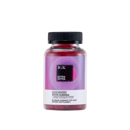 A bottle of IGK Extra Biotin Gummies, for hair dietary supplement.