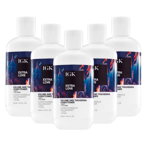 Five bottles of IGK Extra Love Volume and Thickening Conditioner.