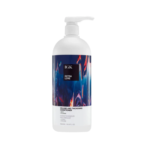 Bottle of IGK Extra Love Volume and Thickening Conditioner with colorful abstract label.