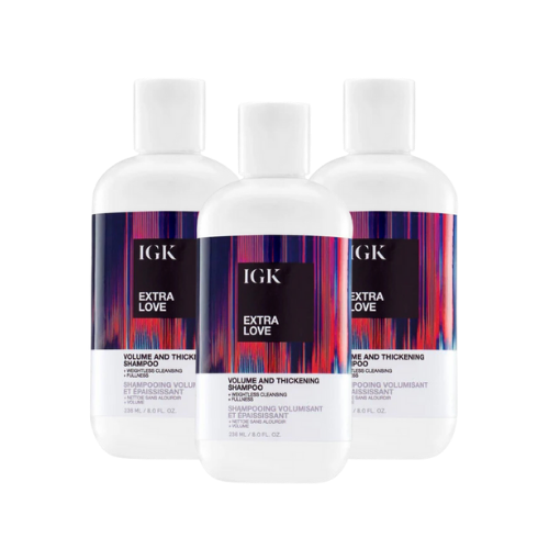 Three bottles of IGK Extra Love Volume and Thickening Shampoo.