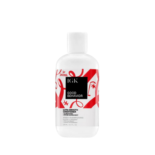 Bottle of IGK Good Behavior ultra-smooth conditioner with red and white design.