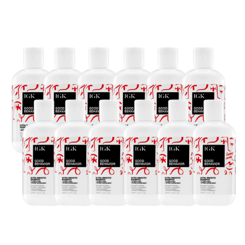Ten bottles of IGK Good Behavior Smoothing Shampoo displayed in a row.