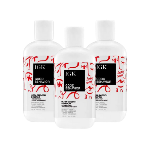 Three bottles of IGK Good Behavior Ultra Smooth Shampoo.
