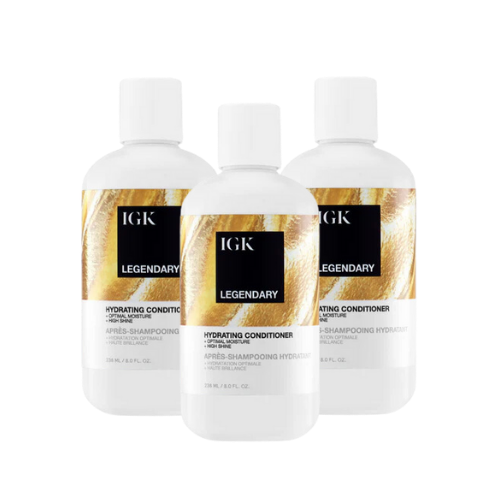 Three bottles of IGK Legendary Hydrating Conditioner.