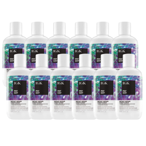 Ten bottles of IGK Pay Day Instant Repair Shampoo are arranged in rows.
